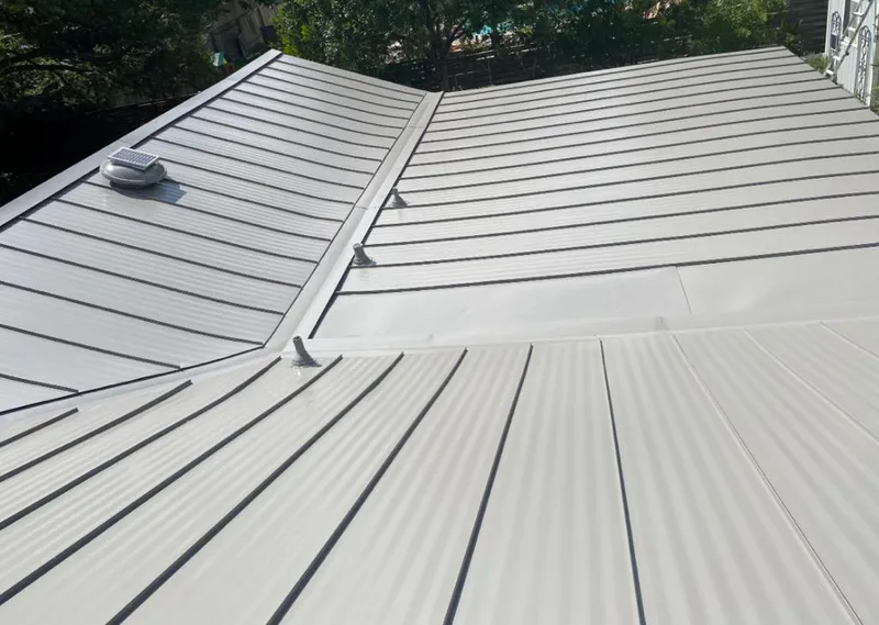 Solar attic fan installed on a metal roof for Roof Ventilation in Surprise